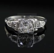 A 1930's/1940's platinum and single stone diamond ring, with diamond set shoulders the centre