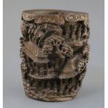 A Chinese bamboo rootwood brushpot, 18th/19th century, carved in high relief and openwork with 75