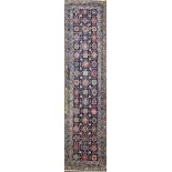 A Caucasian blue ground runner, with geometric field of flower heads and a three row border 13ft 2in