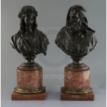 A pair of 19th century French bronze busts of a bearded man and woman wearing a laurel wreath, on