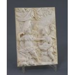 An 18th century Continental relief carved ivory plaque, depicting huntsmen presenting a boar's