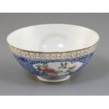 A Chinese famille rose bowl, late 19th century/early 20th century, painted to shaped reserves with