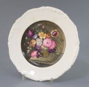 A Rockingham porcelain cabinet plate, c.1830-42, attributed to Edwin Steele, painted with a basket