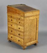 A Regency bird's eye maple Davenport, with writing drawer, two slides and four graduated side