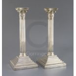 A pair of Edwardian silver corinthian column candlesticks, W.W. Harrison & Co, Sheffield, 1901, 19.