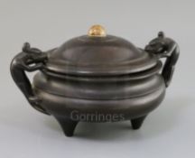 A Chinese bronze tripod censer, ding 18th century applied with a pair of lion-dog handles, six