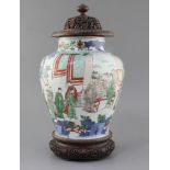 A Chinese wucai baluster jar, Transitional period, 17th century, painted with dignitaries and