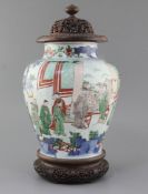 A Chinese wucai baluster jar, Transitional period, 17th century, painted with dignitaries and