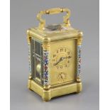 An early 20th century French ormolu and champleve enamel repeating carriage clock with alarm, with