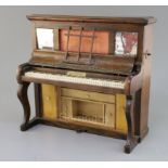 A Victorian novelty rosewood sewing cabinet, in the form of an upright piano, the lid keyboard and