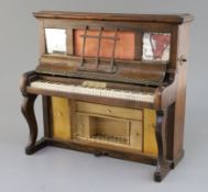 A Victorian novelty rosewood sewing cabinet, in the form of an upright piano, the lid keyboard and