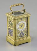 A French miniature brass and champleve enamel carriage timepiece, c.1900, decorated with panels of