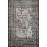 A 19th century Persian ivory ground pictorial rug, depicting a Shah, with animals, birds and other
