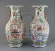 A pair of Chinese famille rose vases, 19th century, each painted with figures in interiors and