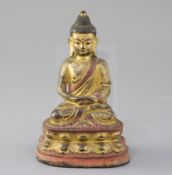 A Sino-Tibetan gilt and polychrome bronze seated figure of Buddha Shakyamuni, 17th/18th century,