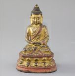 A Sino-Tibetan gilt and polychrome bronze seated figure of Buddha Shakyamuni, 17th/18th century,
