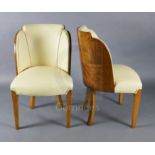 A set of six Art Deco tiger maple cloud back dining chairs, with cream leather upholstery on