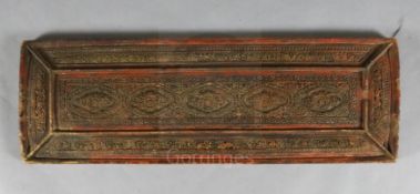 A Tibetan carved panel, 18th/19th century, carved in relief with sanskrit inscriptions and scrolling