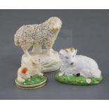 Three Rockingham porcelain figures of sheep, c.1830, the smallest of a lamb painted in colours,