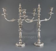 A pair of 19th century Sheffield plate two branch three light candelabra, with engraved crest, 52.