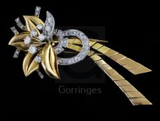 A mid 20th century French 18ct gold and diamond set stylised flower head clip brooch, with two