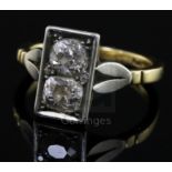 An 18ct gold, platinum and two stone diamond rectangular tablet ring, set with two old cut stones,