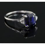 A 1940's? platinum, sapphire and diamond three stone ring, the central emerald cut sapphire