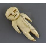 A Tongan or Fijian whale tooth pendant, carved in the form of a human, H. 5.5cmcf. a whale ivory