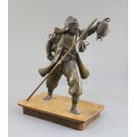 A Japanese bronze figure of a Samurai, Meiji period, the figure holding a lantern in his left hand