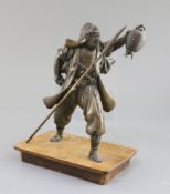 A Japanese bronze figure of a Samurai, Meiji period, the figure holding a lantern in his left hand