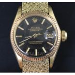 A ladys' 18ct gold Rolex Oyster Perpetual Datejust Superlative Chronometer, having black dial with