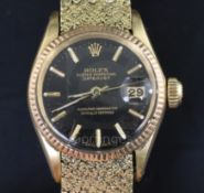 A ladys' 18ct gold Rolex Oyster Perpetual Datejust Superlative Chronometer, having black dial with