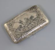 A late 19th century Russian 84 zolotnik silver and niello cigarette case, decorated with scene of