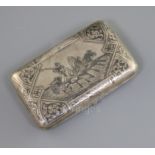 A late 19th century Russian 84 zolotnik silver and niello cigarette case, decorated with scene of