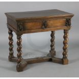 A late 17th century Italian walnut side table, with later oak inset top, the frieze drawer centred