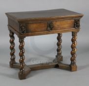 A late 17th century Italian walnut side table, with later oak inset top, the frieze drawer centred