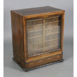 A George III mahogany and yew wood table cabinet, the top and sides inlaid with oval panels within