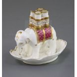 A Rockingham porcelain 'elephant' quill holder, c.1830-42, decorated in maroon and gilt, puce