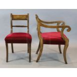 A set of nine Regency mahogany dining chairs, including two carvers, with tablet cresting rails