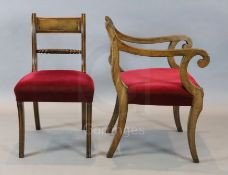 A set of nine Regency mahogany dining chairs, including two carvers, with tablet cresting rails