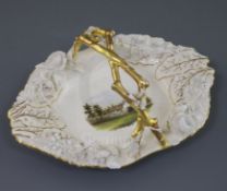 A Rockingham porcelain oblong octagonal basket, c.1830-42 finely painted with a titled view of '
