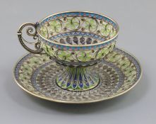 An early 20th century Norwegian silver, enamel and plique a jour cup and saucer, by Marius Hammer,