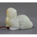 A Chinese white jade figure of a recumbent lion-dog, possibly 18th century, The stone of good even