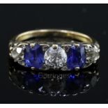 An early 20th century 18ct gold, graduated two stone sapphire and three stone diamond half hoop