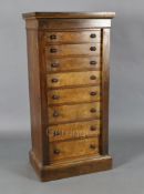 A Victorian figured walnut collector's chest, of eight graduated long drawers with side locking