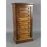 A Victorian figured walnut collector's chest, of eight graduated long drawers with side locking