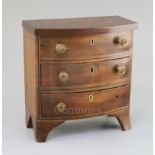 A Regency mahogany miniature bowfront chest, fitted three drawers, 7.25in., height 7.5in.