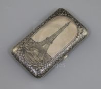 A late 19th century Russian 84 zolotnik silver and niello cigarette case, decorated with a view of