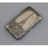 A late 19th century Russian 84 zolotnik silver and niello cigarette case, decorated with a view of