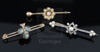 Three assorted Victorian gold and gem set bar brooches, one modelled as clover set with cat's eye
